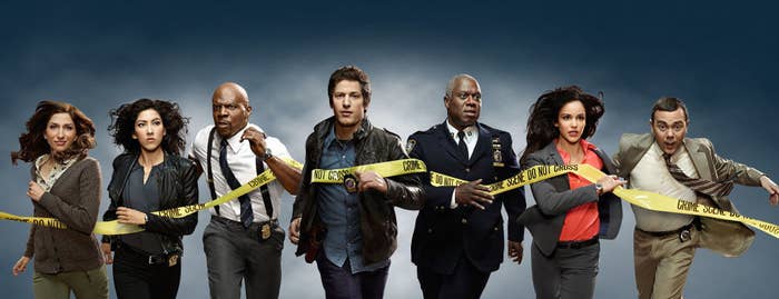 From left to right: Chelsea Peretti, Stephanie Beatriz, Terry Crews, Melissa Fumero and Joe Lo Truglio run through police tape