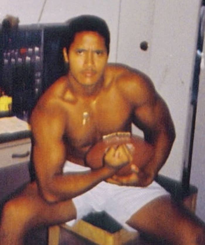 A very muscular 15-year-old Rock flexing and holding a football