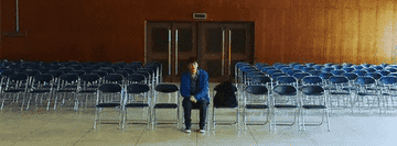 Park Hyung-sik awkwardly sits in an empty room full of chairs