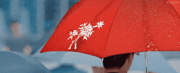 Lee Dong-wook walks in the rain with an umbrella