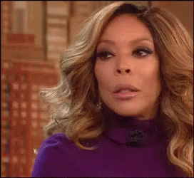 Wendy Williams shake her head with disapproval and drinking from a mug