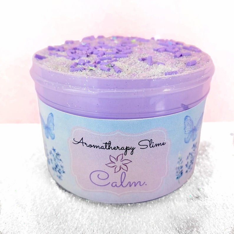 the lavender slime with shimmers and crunchy bits on the top and butterflies and flowers on the packaging 