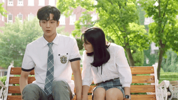 Rowoon awkwardly tries to shuffle away from Kim Hye-yoon who keeps scooting closer to him on a bench
