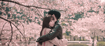 Jung Hae-in and Chae Soo-bin smile and hug while cherry blossoms fall