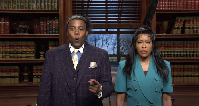 Regina King's hair is in a half-up, half-down style with the ponytail standing straight up as if stuck due to adhesive as she stands next to Kenan Thompson