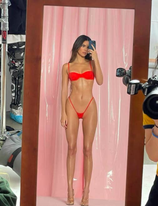 Kendall Jenner wearing a tiny thong bikini and taking a selfie