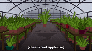 Gif of excited people in a greenhouse with caption &quot;cheers and applause&quot;