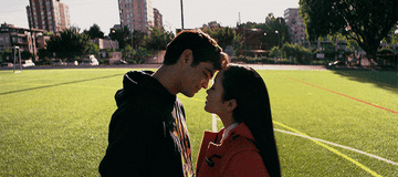 Peter and Lara Jean kissing on the lacrosse field