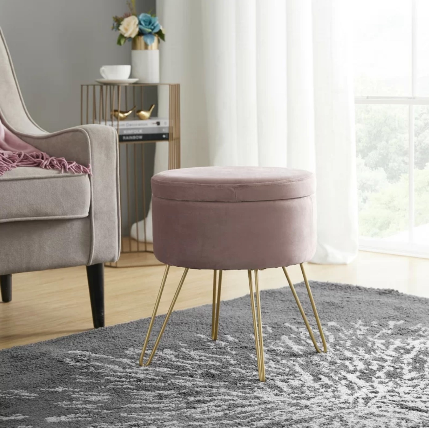 The velvet storage ottoman in blush