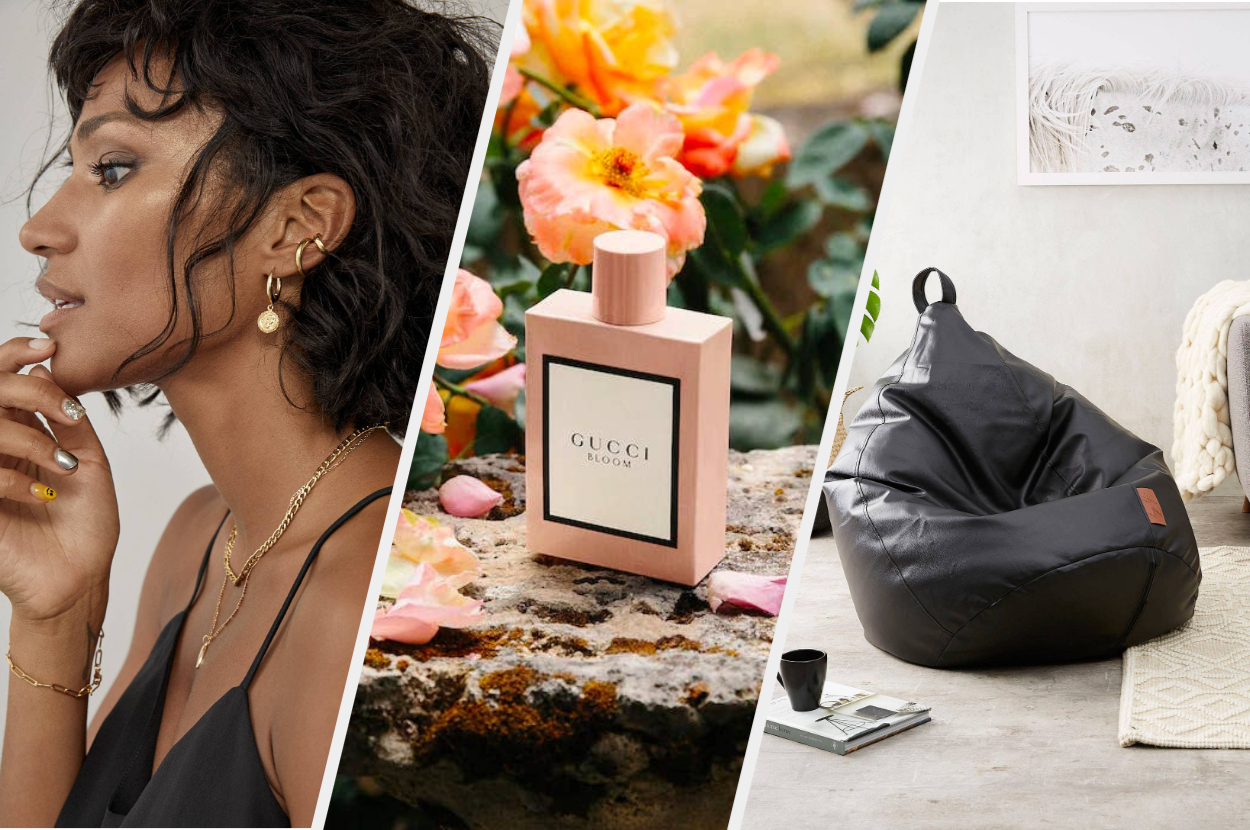 A person wearing multiple earrings on their ear, A bottle of perfume on a stone with flowers behind it, A large beanbag chair on the floor