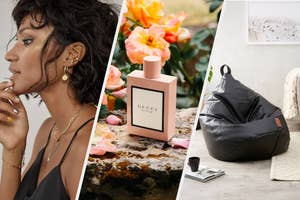 A person wearing multiple earrings on their ear, A bottle of perfume on a stone with flowers behind it, A large beanbag chair on the floor