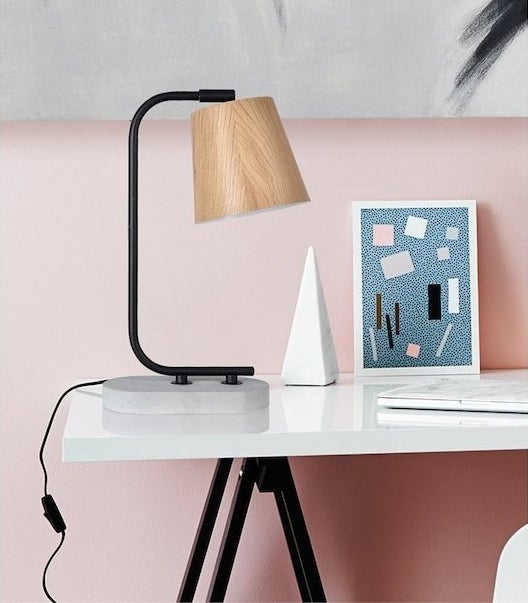 A table lamp on a desk 