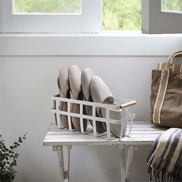 A basket with slippers in it