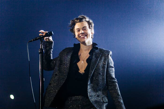 Harry Styles performing on stage