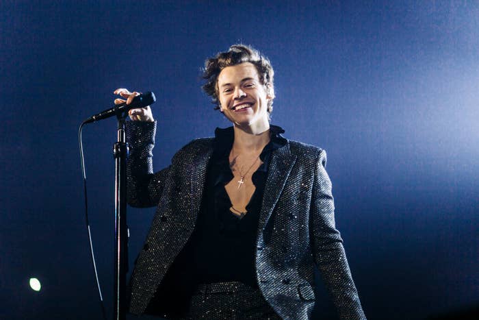 Harry Styles performing on stage