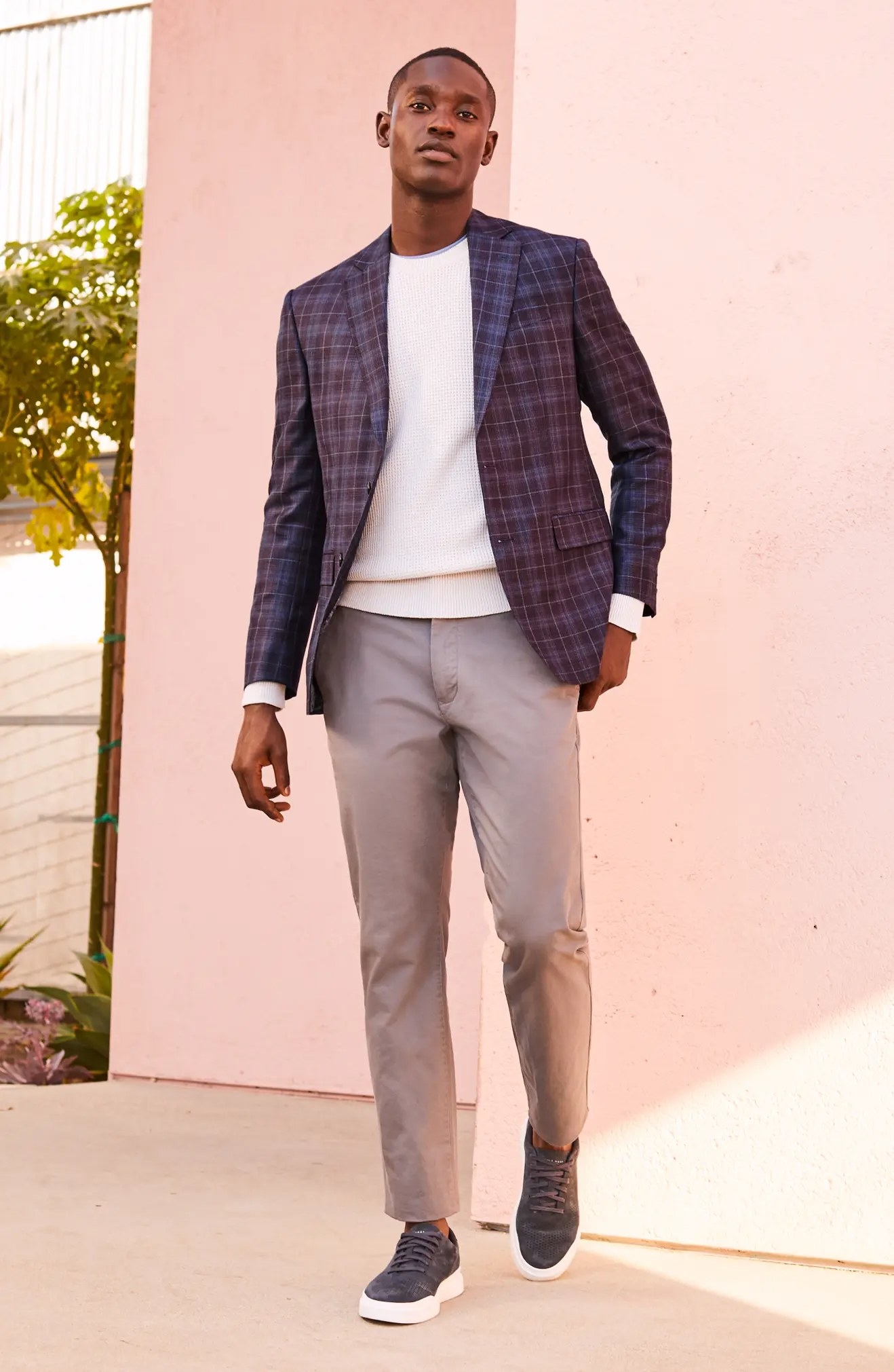 A model wearing the chinos in grey