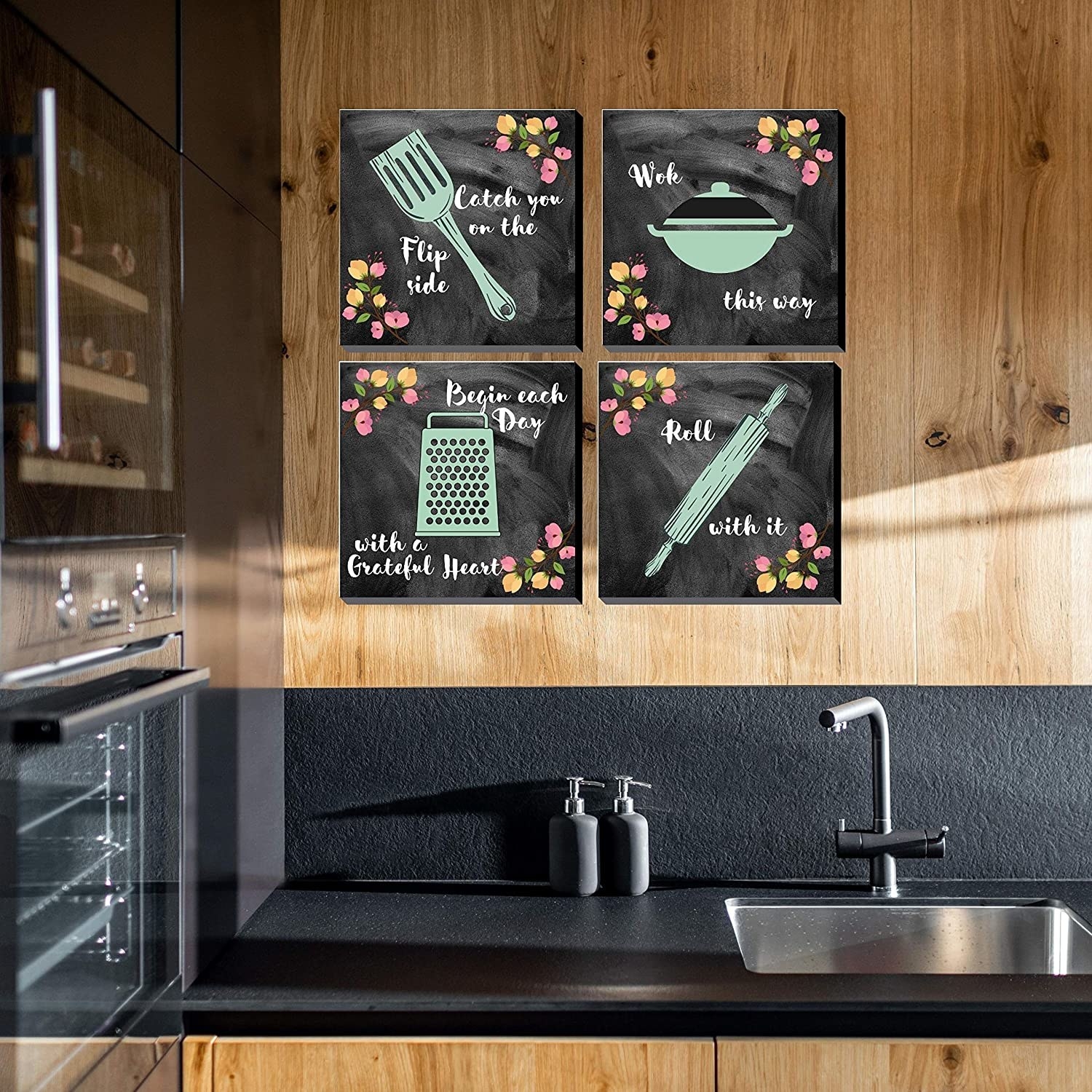 4 chalkboard frames hung up on a kitchen wall. They have punny quotes on them like, "Catch you on the flip side", "Wok this way", "Begin each day with a grateful heart", and "Roll with it".