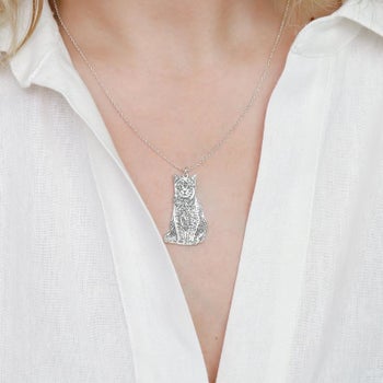 Model wearing the cat pendant