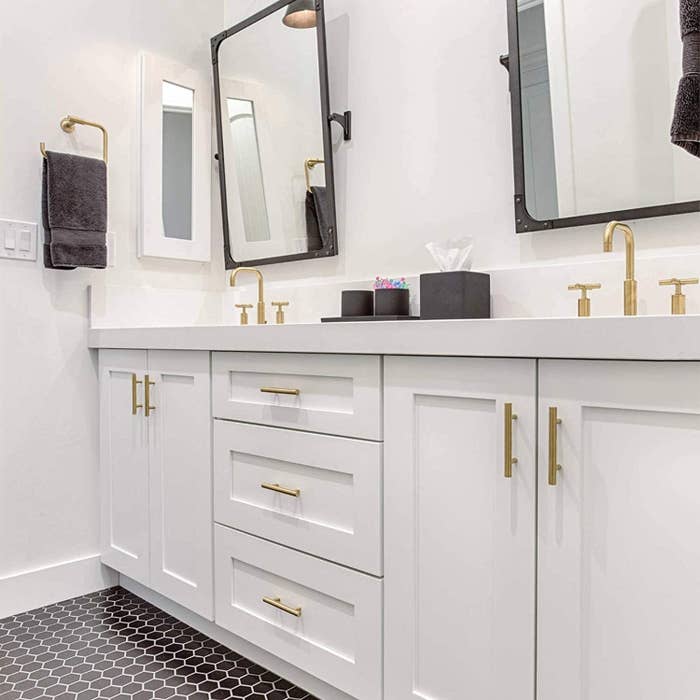 a bathroom dresser with the knobs installed