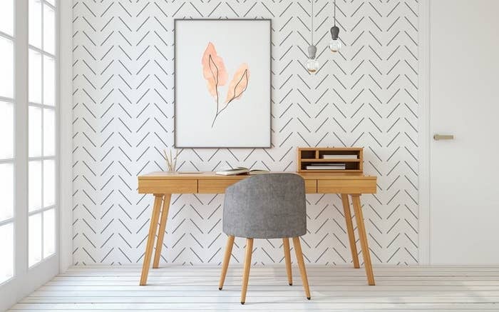 A desk against a wall with the wallpaper