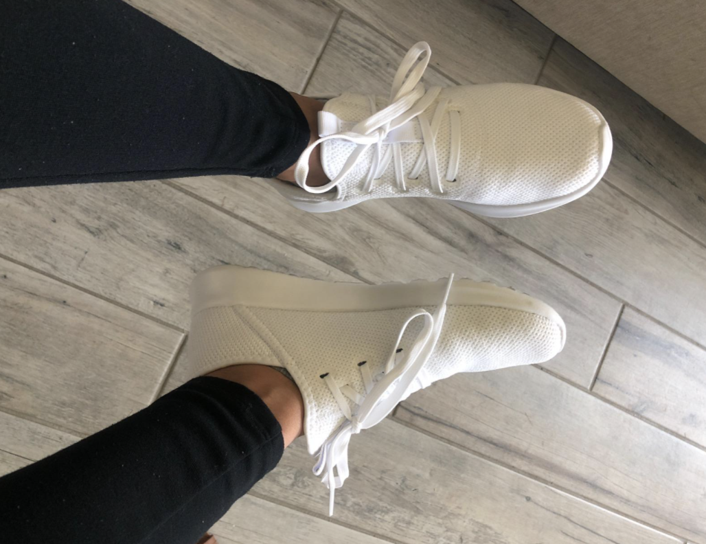 reviewer wearing cloudfoam sneakers in white