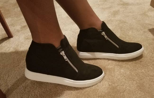 reviewer wearing hidden wedge sneakers