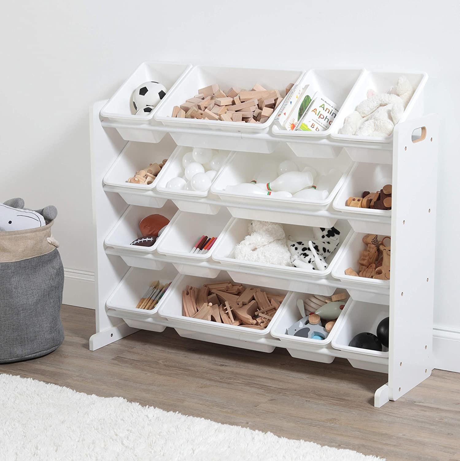 Minimalist white shelving with matching removable containers in varying sizes. It has four shelves.