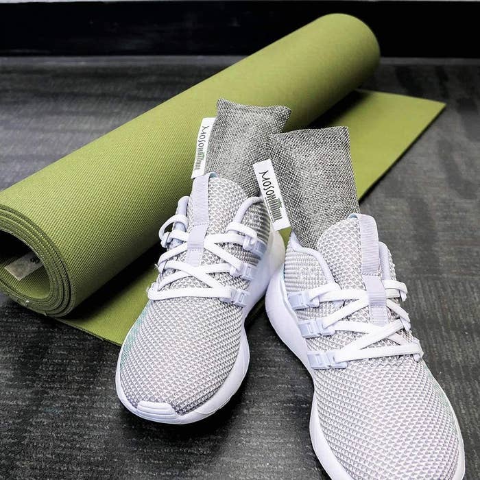 A pair of running shoes with air purifying bags in them