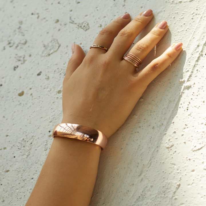 model wearing the cuff in gold