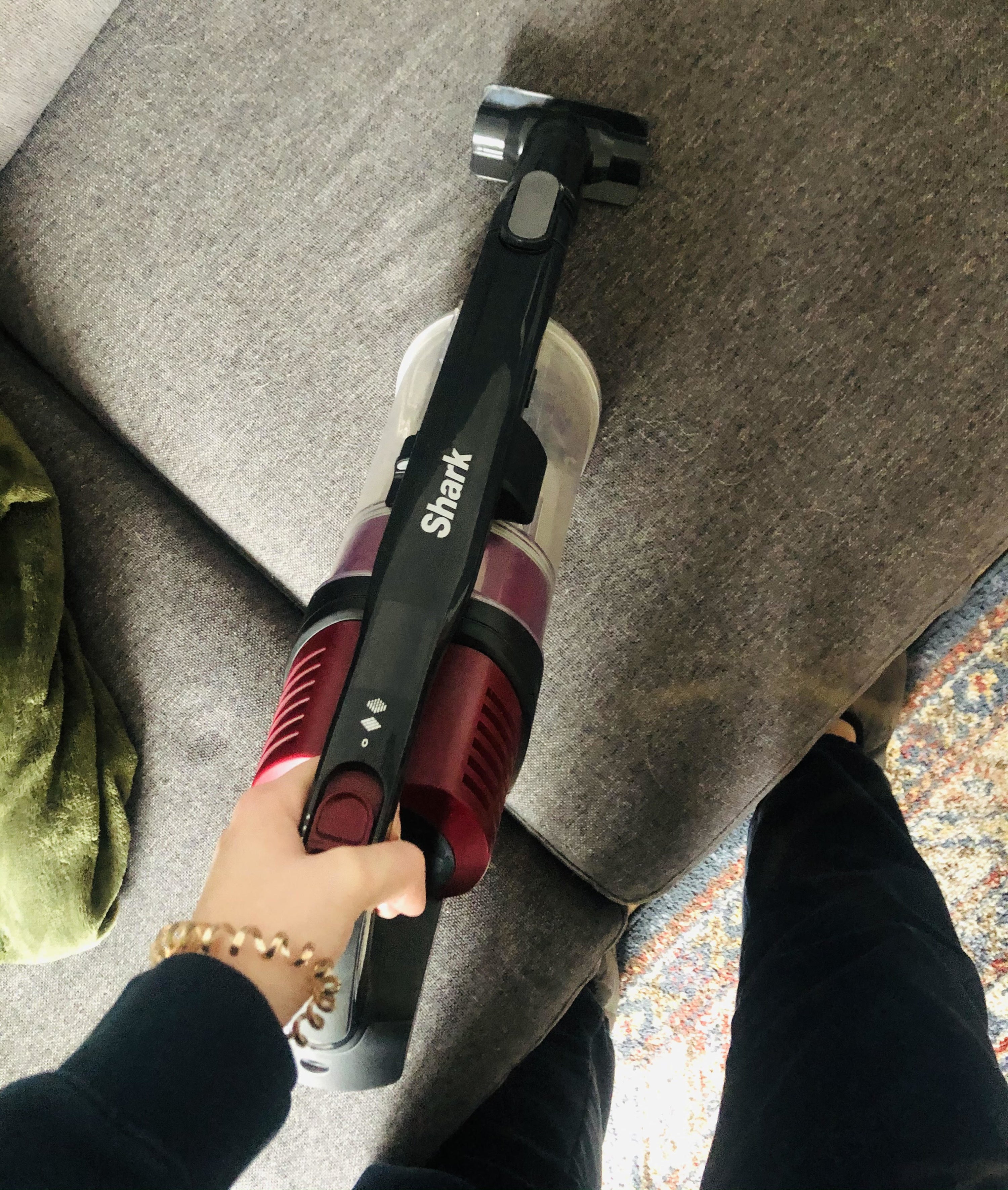 Alice vacuuming her couch cushions