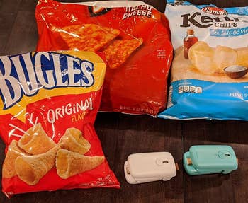 a reviewer's photo of the blue and white sealers in front of bags of chips