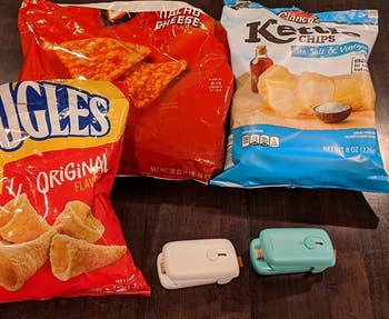 a reviewer's photo of the blue and white sealers in front of bags of chips