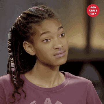 Willow Smith tilts her head back and widens her eyes on Red Table Talk