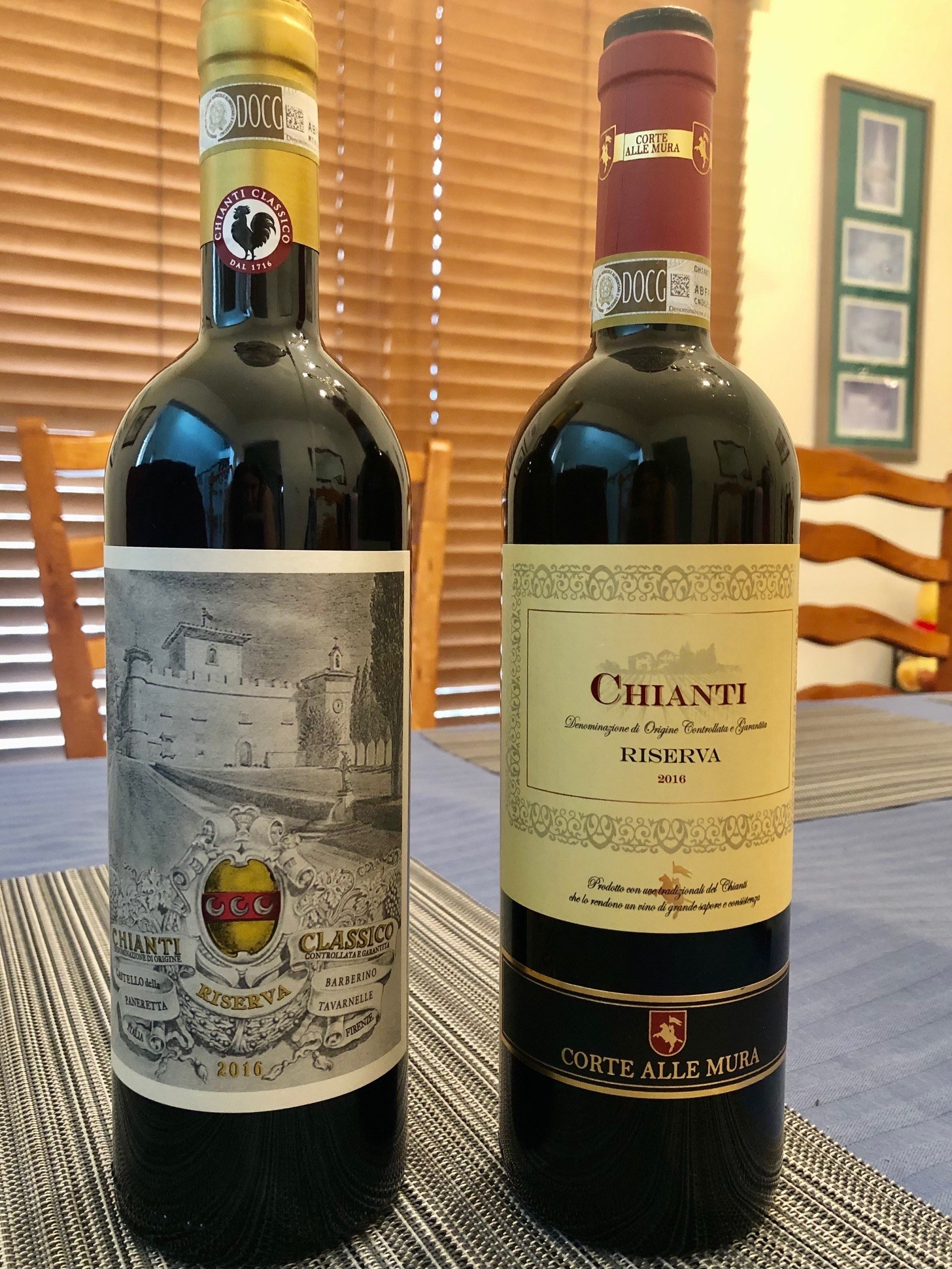 Two bottles of Chianti wine on a table