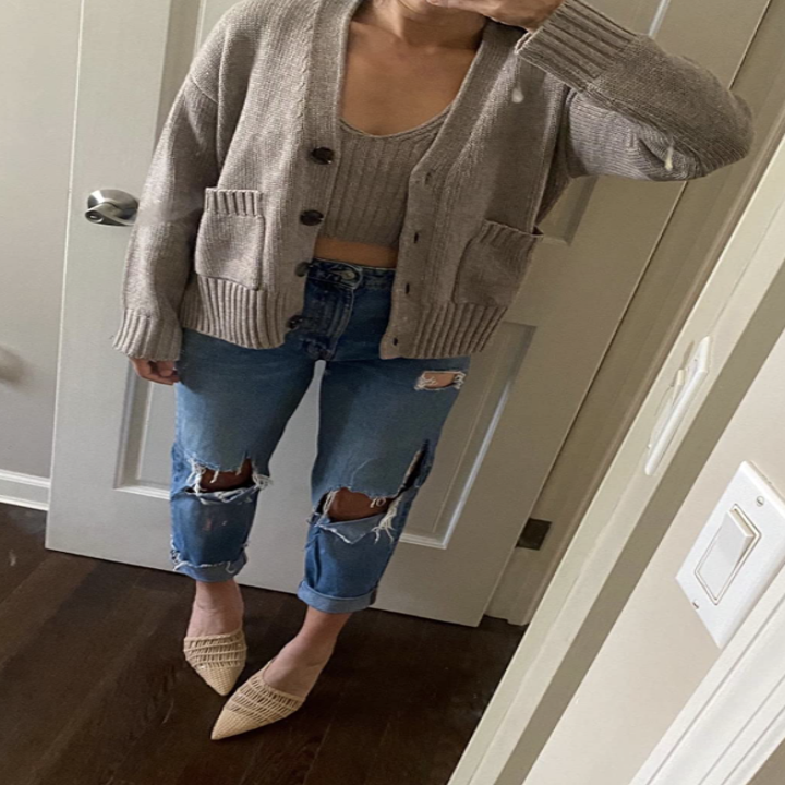 reviewer wearing cardigan