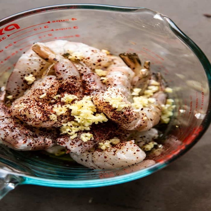 Marinating shrimp in garlic and ginger.