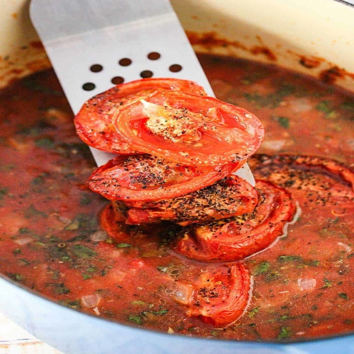 Making tomato soup from roasted tomatoes.