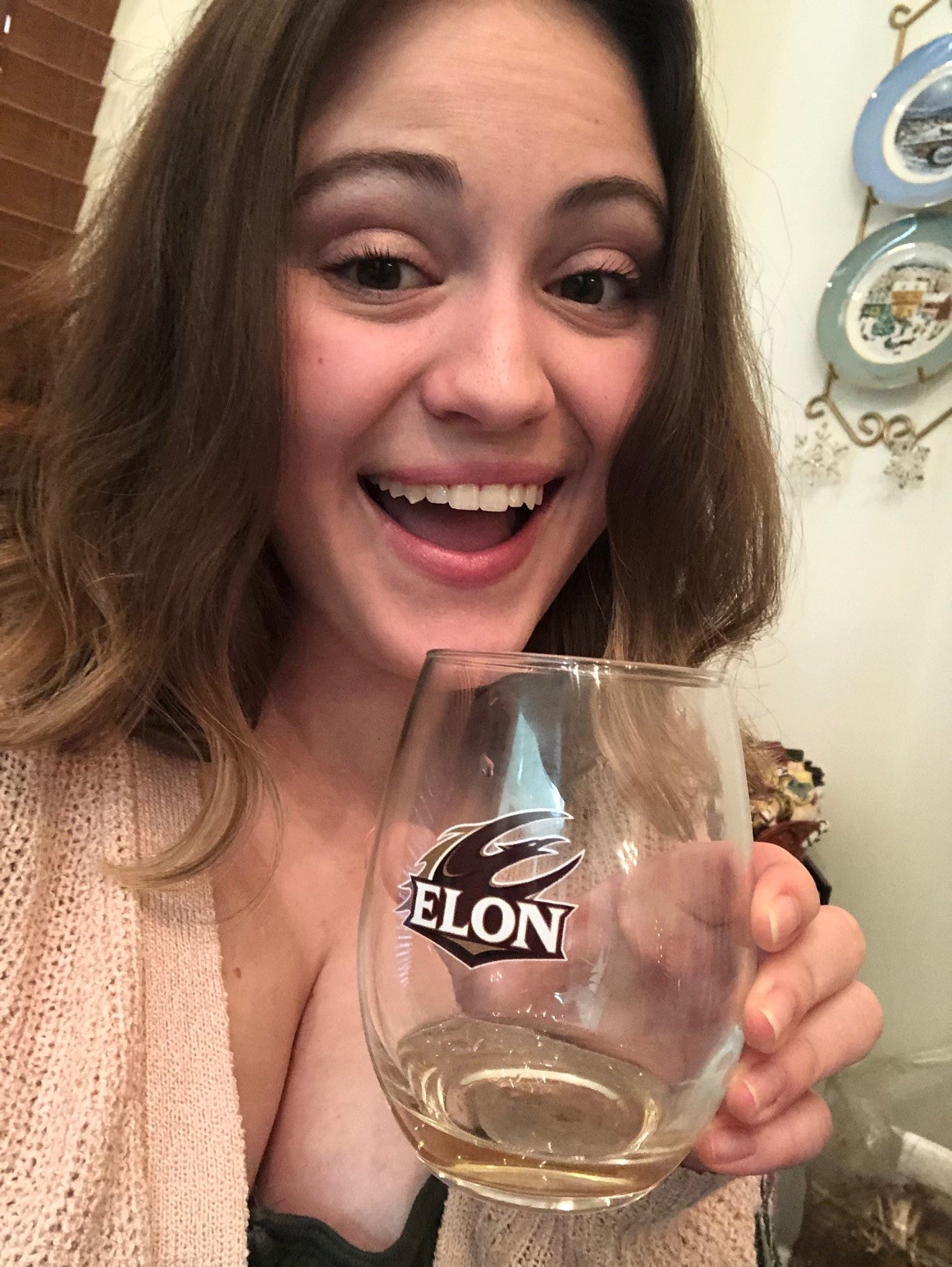 Woman holding a glass of white wine