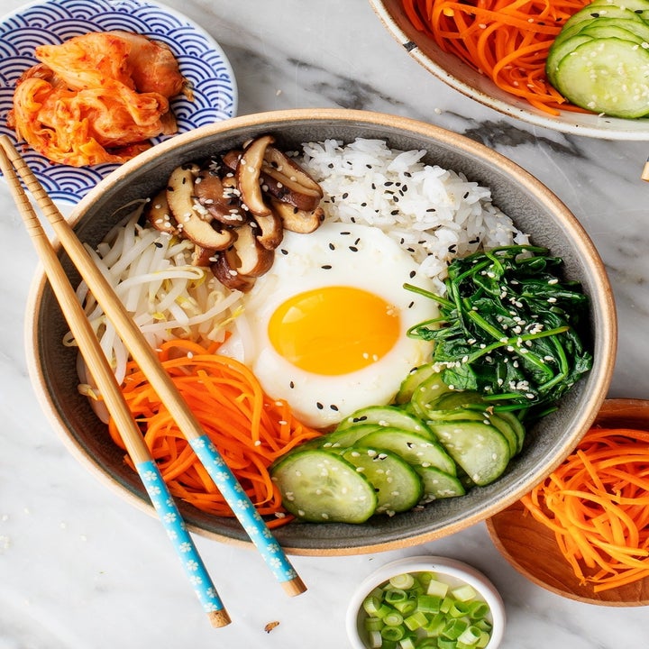 A bowl of veggie bibimbap with a fried egg.