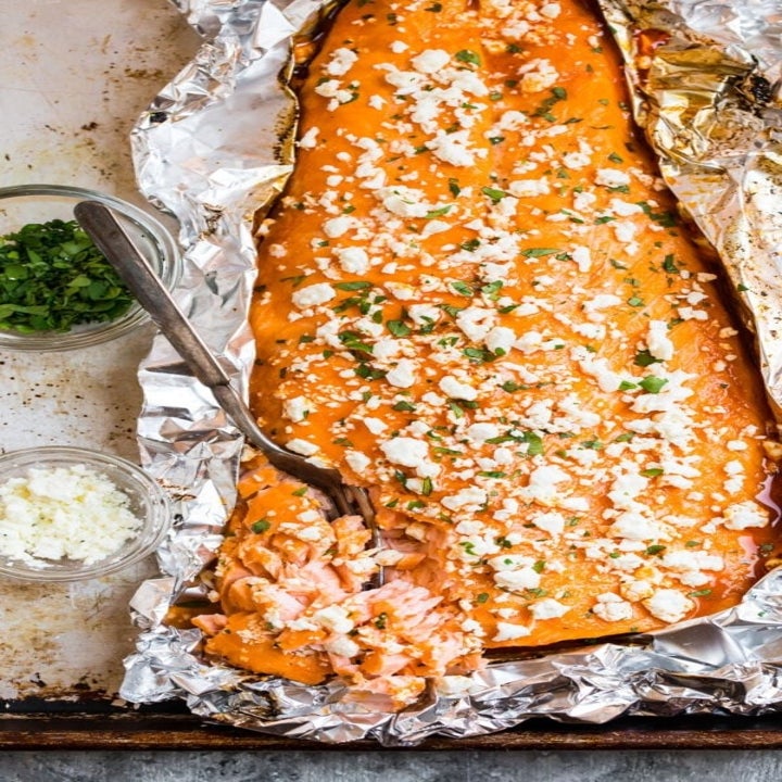 Buffalo baked salmon topped with blue cheese and herbs.