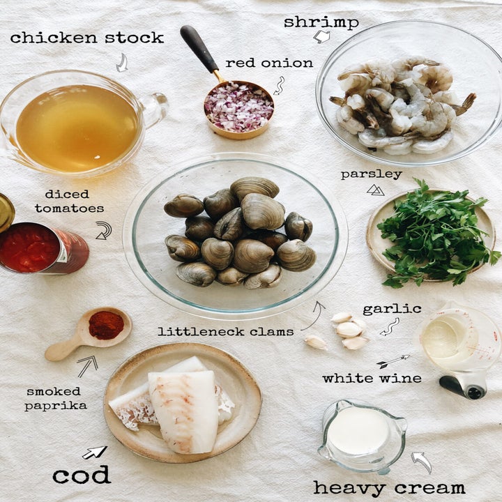 Ingredients for seafood soup in mixing bowls.