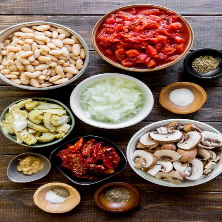 Ingredients for white bean skillet in mixing bowls.