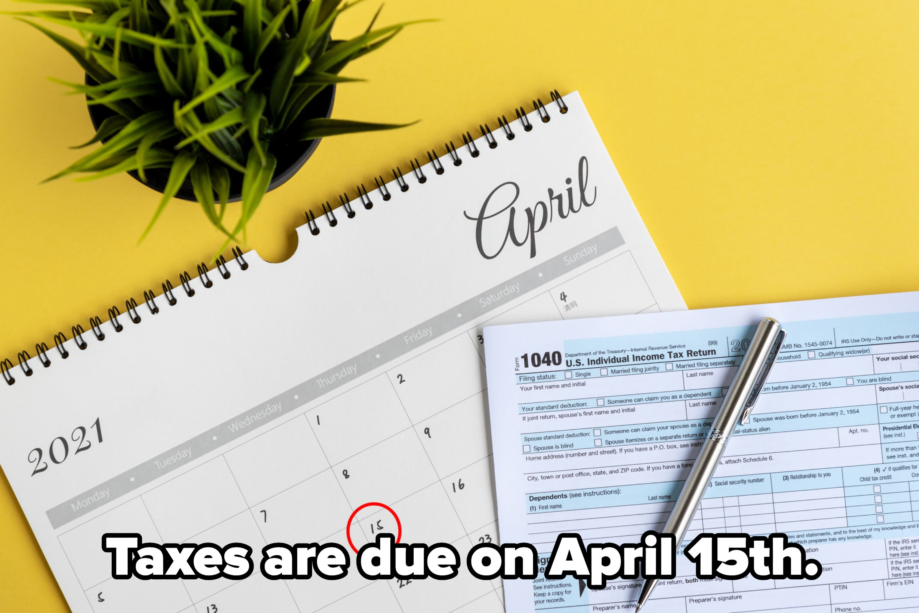 Tax form laid over a calendar with April 15 circled