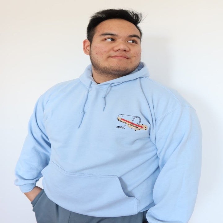 a model wearing a light blue boba hoodie