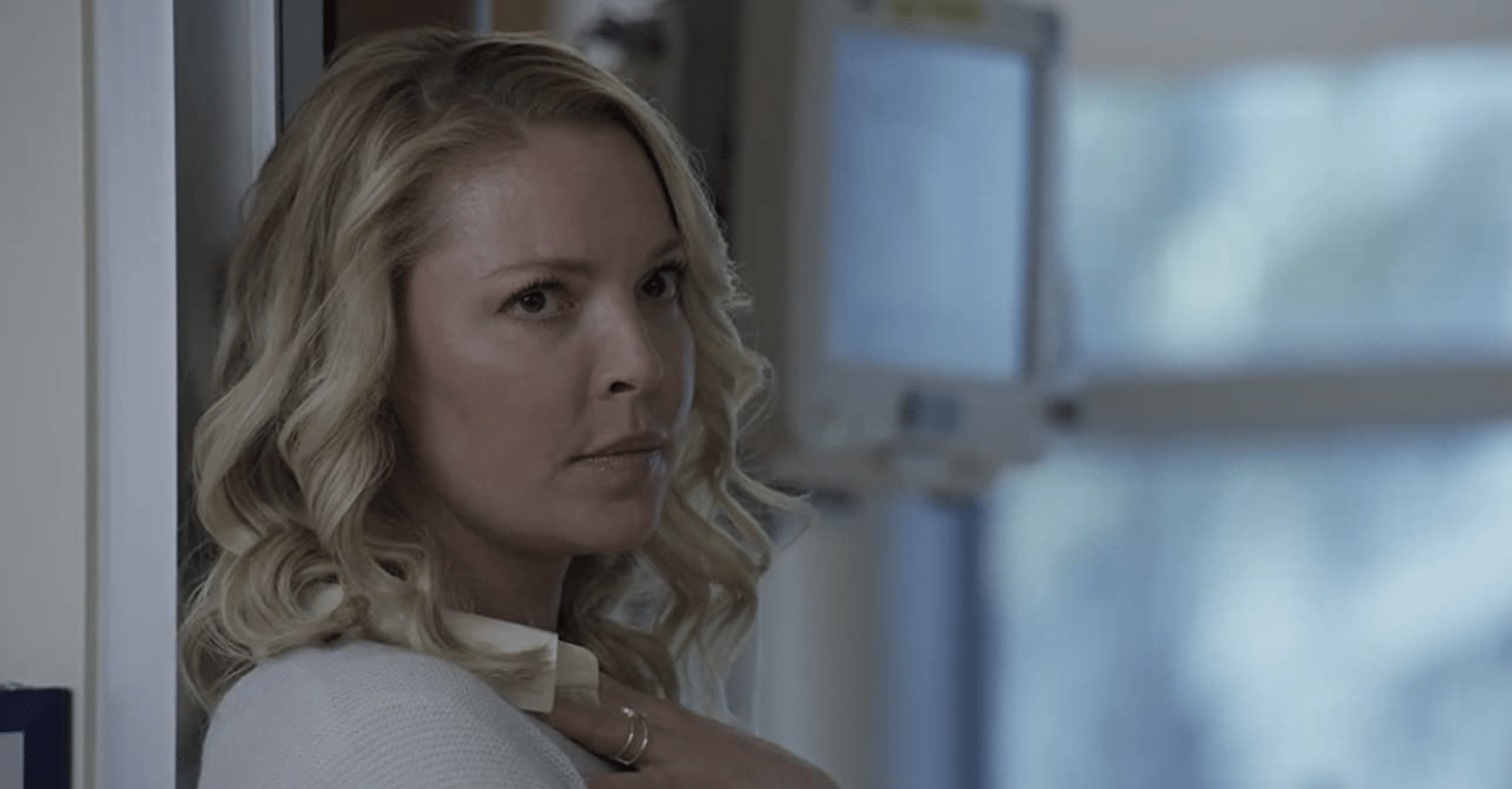 Katherine Heigl in Fear Of Rain leaning against a door frame