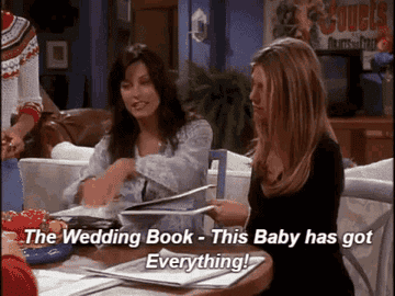 GIF from Friends of Monica sitting with Rachel and saying &quot;the wedding book -- this baby has everything!&quot;
