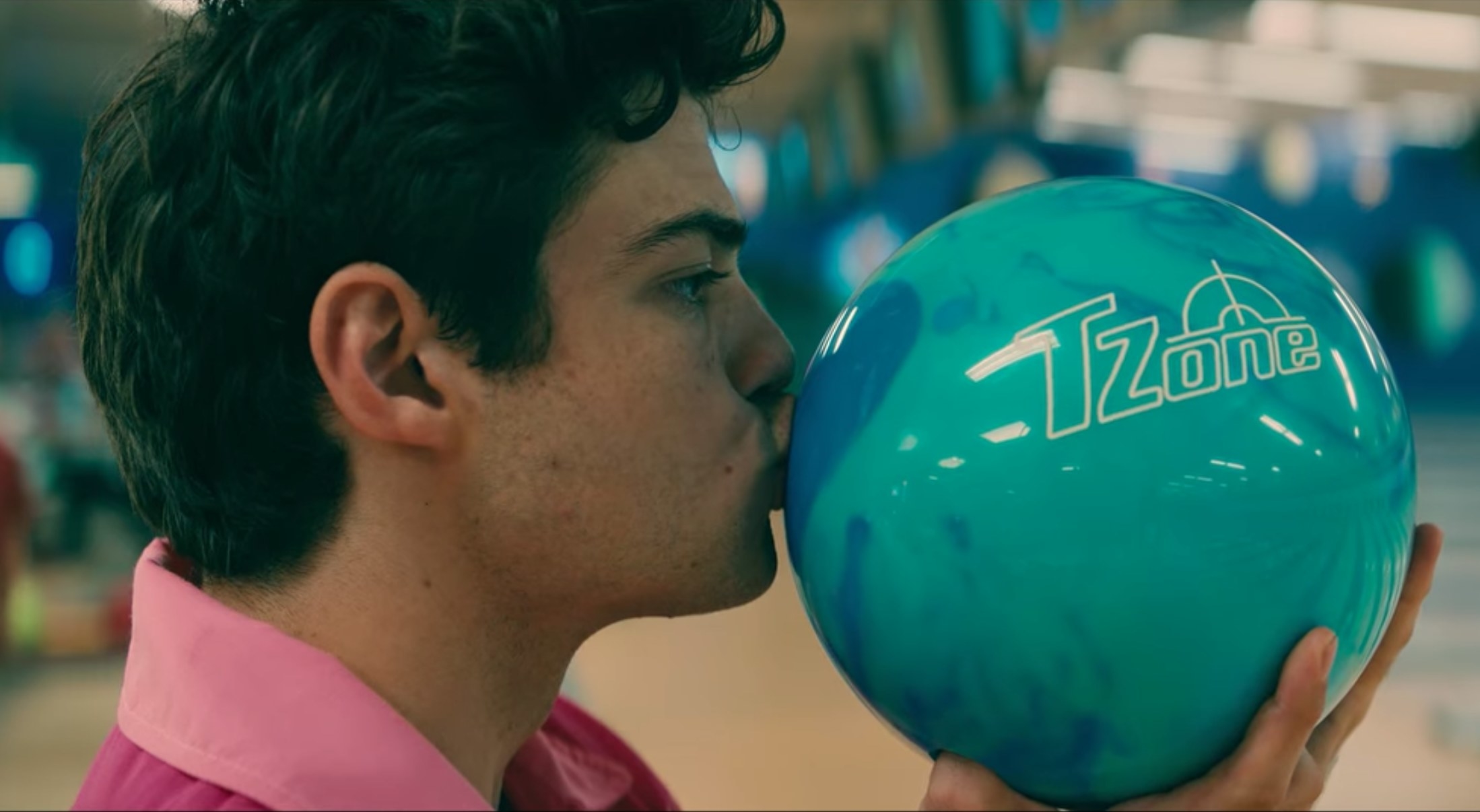 Peter kisses a bowling ball