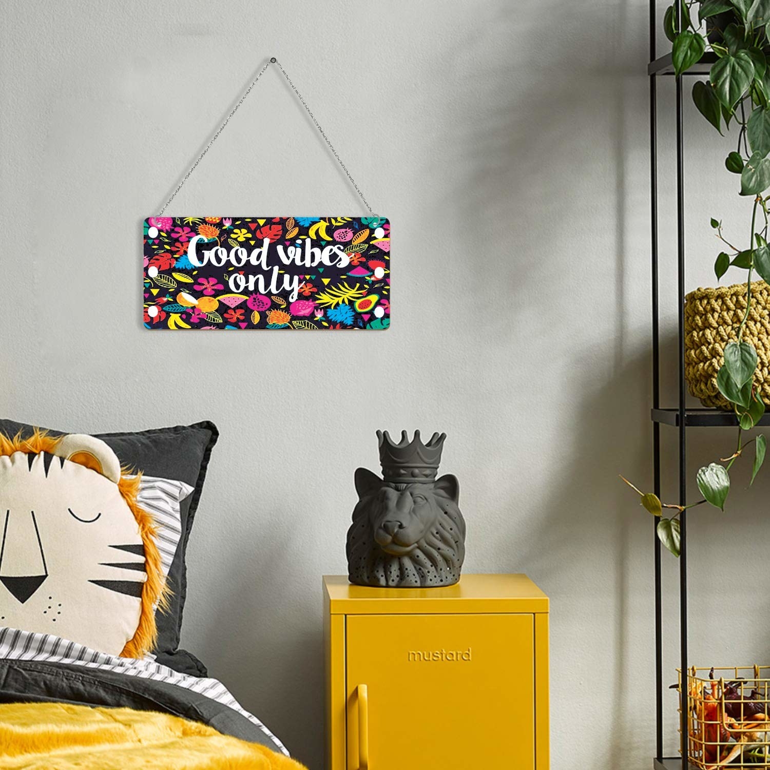 A wall hanging hung up on a wall in a bedroom