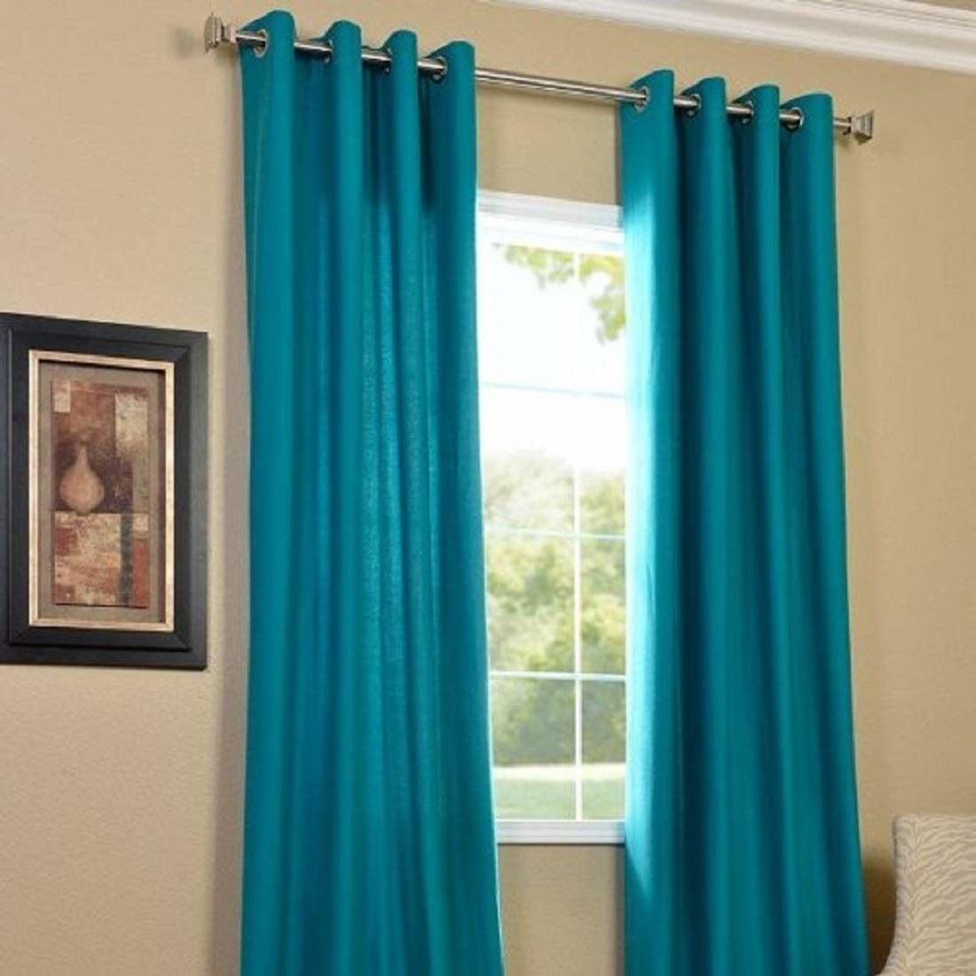 Two aqua curtains on a window