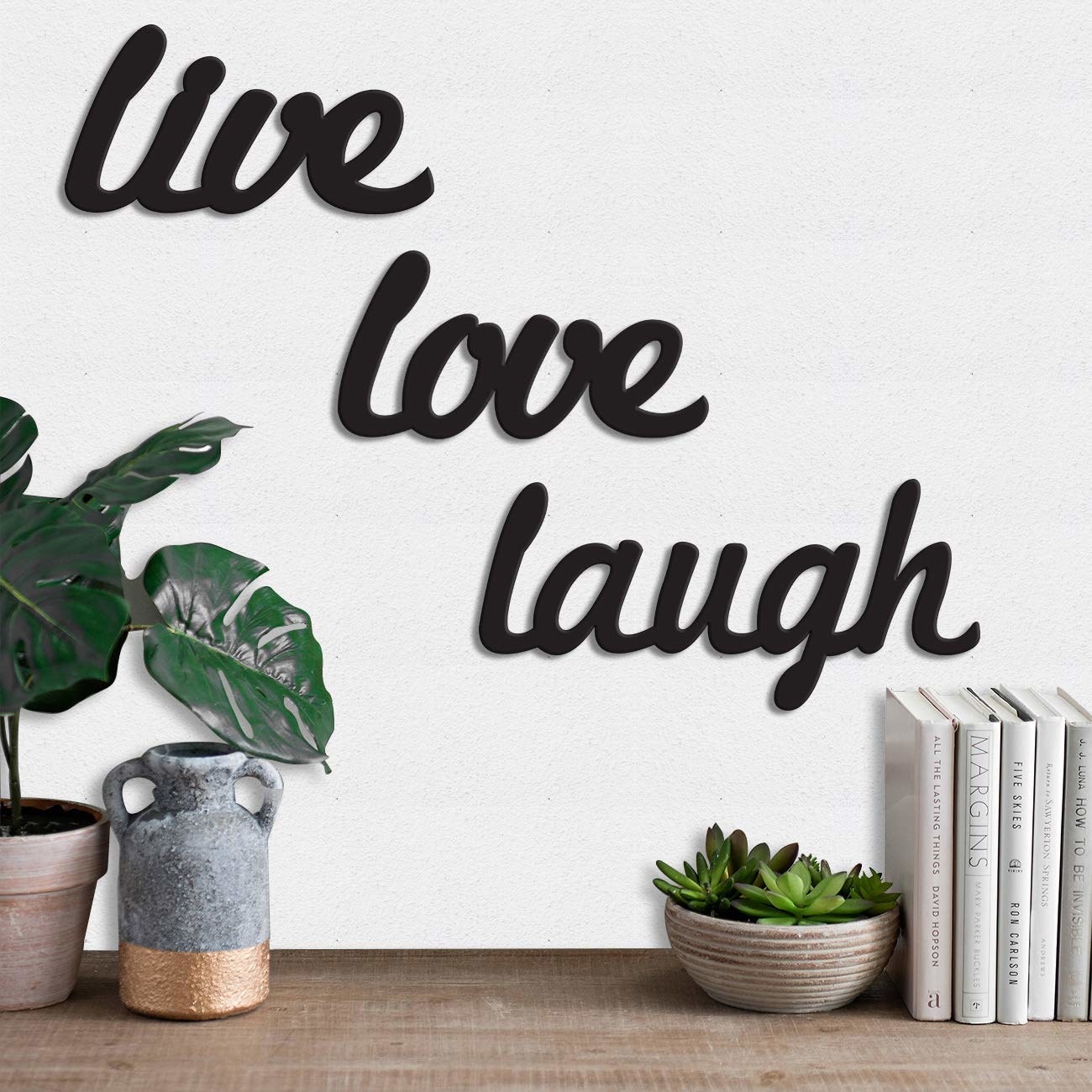 A wall plaque that says Live Love Laugh